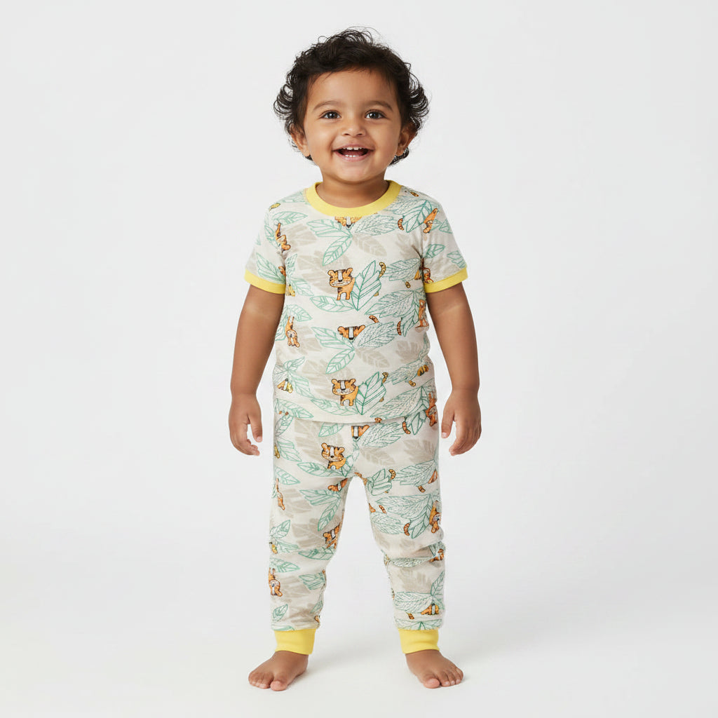 Children's pajama set with animal and leaf pattern on a white background
