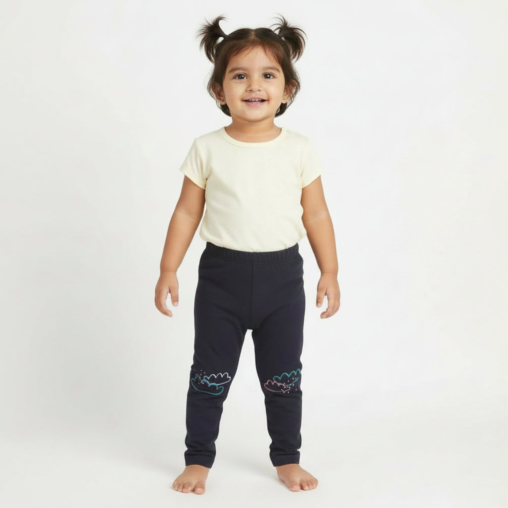 Dark gray leggings with cloud designs on a light gray background