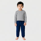 Navy blue jogger pants worn by a child on a white background