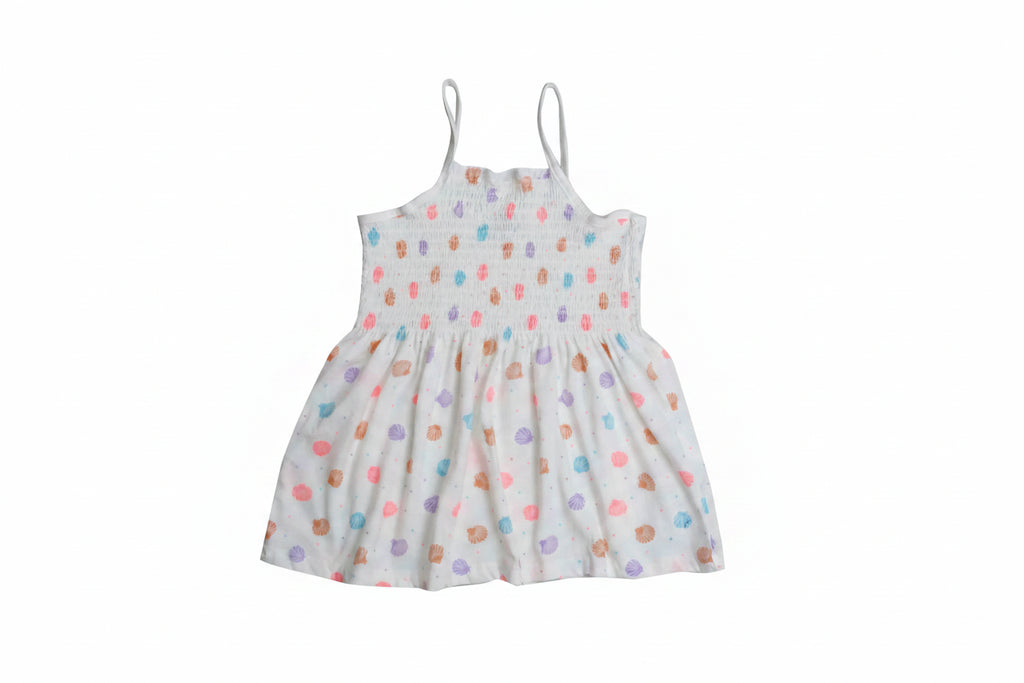Children's dress with colorful polka dot pattern on a white background