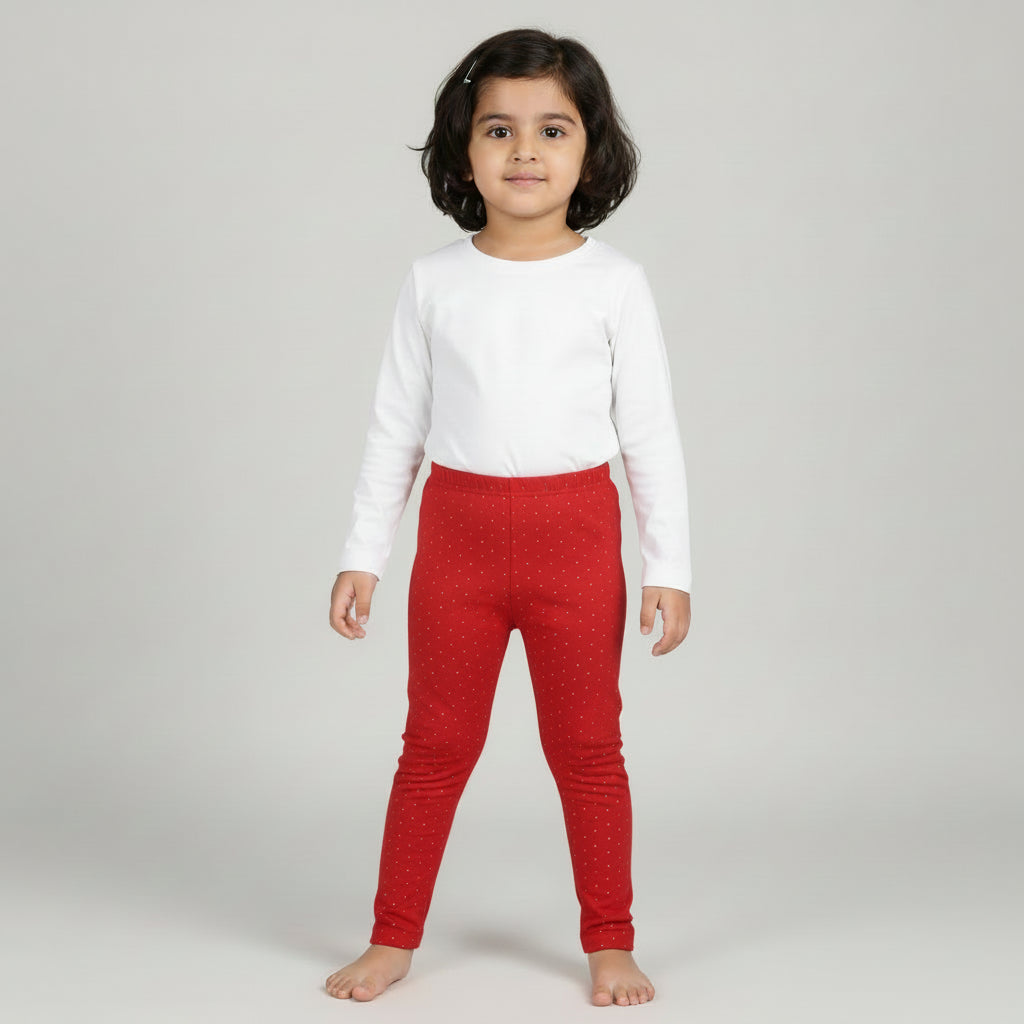 Red leggings with a gold glitter on a light gray background