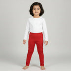 Red leggings with a gold glitter on a light gray background